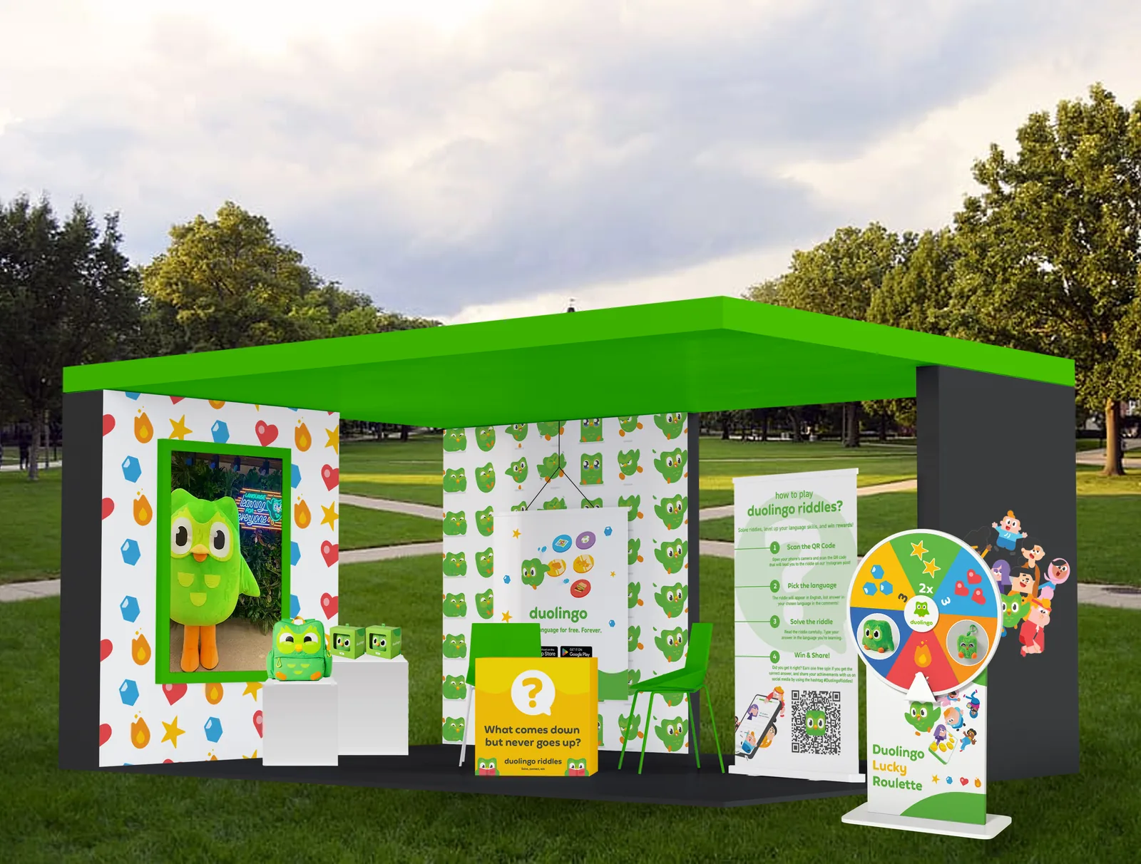 Duolingo Riddles pop-up booth with a riddle desk, prize wheel and how-to-play banner
