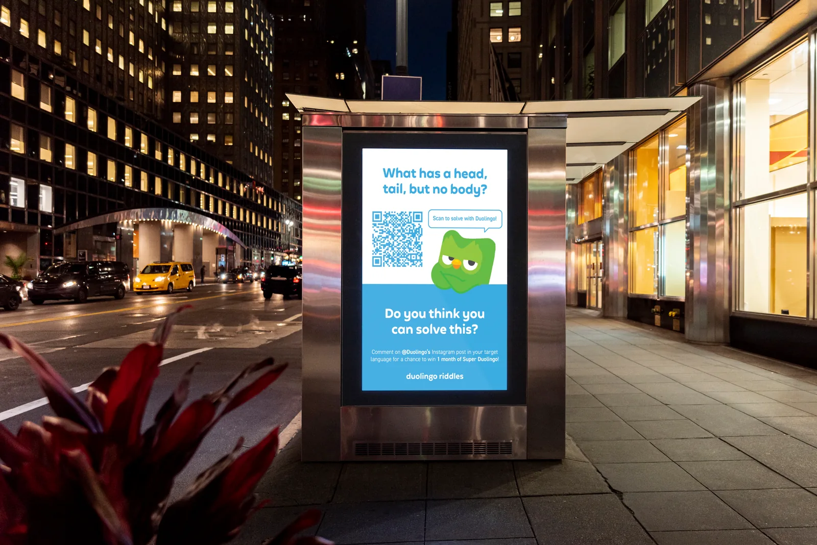Bus shelter ad at night: what has a head, tail, but no body?